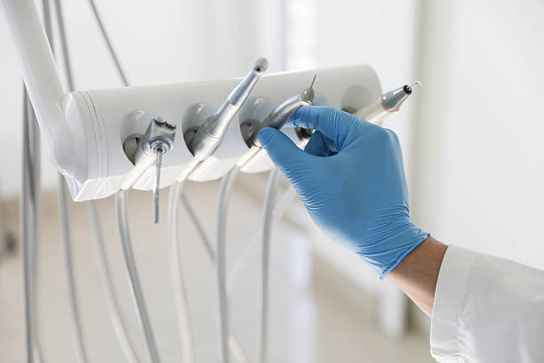 Professional Tooth Extraction technician working in St. George, KS